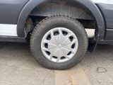 a truck with a flat tire that is parked in a parking lot