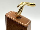 a small wooden box with a gold handle on it