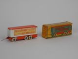 two toy trains that are sitting next to each other