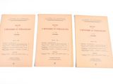 three pamphlets for the first world war are on display on a table