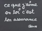un tableau noir sur lequel est écrite une citation