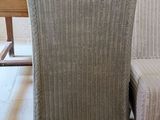 two chairs sitting next to a table in a room