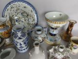many different types of vases and bowls on the table