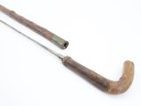 a wooden handle and a metal handle on a white surface