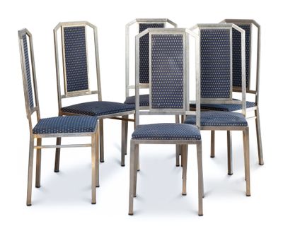four chairs with blue upholstered seats and a metal frame