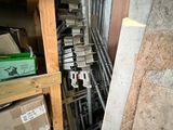 a pile of boxes sitting on a shelf in a room