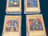 four cards of different types of card games on a blue background