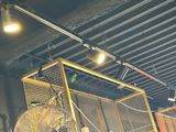 a fan that is hanging from the ceiling in a room