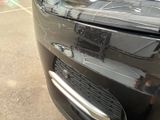 a close up of a car ' s front bumper and grille