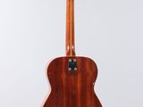 a wooden guitar hanging from a string on a white background