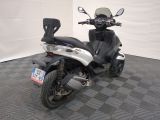 a motor scooter that is parked in a room
