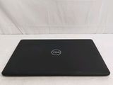 the dell laptop is sitting on a white surface with a white background