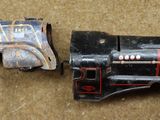 a small toy gun that is laying on the ground