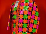 an orange and green jacket on a mannequin mannequin mannequin mannequin mannequin mannequin mannequin mannequin mann