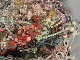 a pile of assorted jewelry on a table