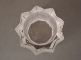 a silver bowl sitting on top of a table