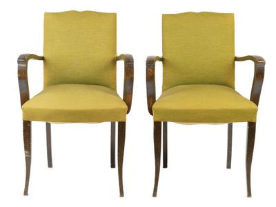 pair of green upholstered chairs with wood legs
