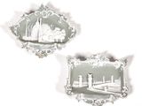 two plaques with a picture of a city on them