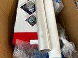 a cardboard box with a roll of white paper in it