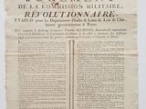 un morceau de papier portant un cachet de cire rouge