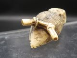 a small turtle that is sitting on top of a table