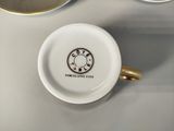 a coffee cup that is sitting on a table