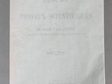 a white book with black writing on it sitting on top of a table