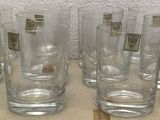 a lot of glasses that are sitting on a table