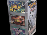 a box of pokemon trading cards on a black background