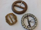 three different types of brooches are displayed on a table