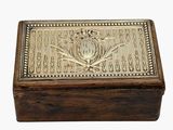 an old wooden box with a decorative design on the lid