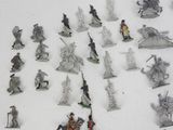 a lot of figurines that are sitting on a table