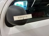 a sticker on the side mirror of a white car