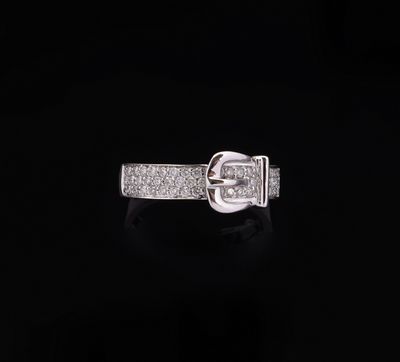 a white gold ring with diamonds on a black background