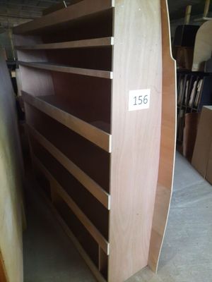a wooden shelf with a number on it in a room