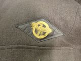 a close up of a jacket with a badge on it