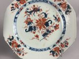a plate with flowers on it sitting on a table