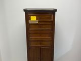 an image of a wooden cabinet with a yellow label on it