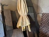 a wooden crate with a yellow cloth hanging from it
