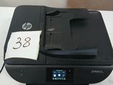 a printer that is sitting on a table with a price tag on it