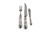 two forks and a knife sitting next to each other