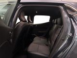 the back seats of a car with the door open in a parking lot