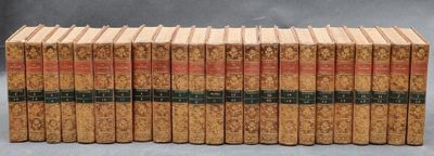 several books are stacked on top of each other on a table