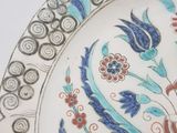 a plate with a floral design on it on a table