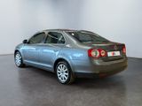 a picture of a silver car in a room