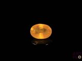 a close up of a yellow moon in the dark sky