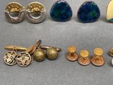 many different types of jewelry on display on the table