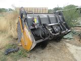 an image of a tractor that is parked on the side of the road