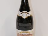 a bottle of wine that is sitting on a table