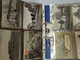 a lot of old photos in a binder on the table